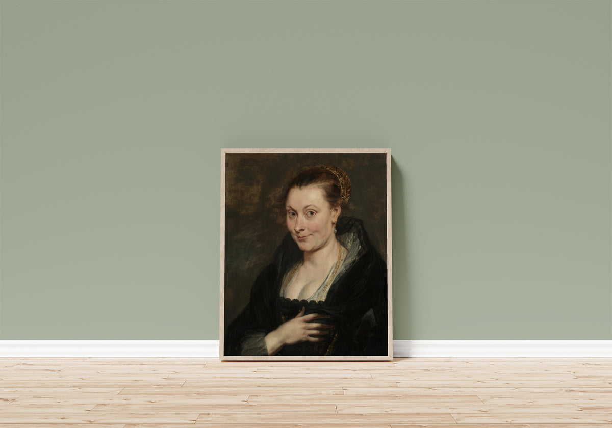 Framed art print of Portrait of Isabella Brant by Peter Paul Rubens, in a light wood frame leaning on a sage green wall above a wooden floor