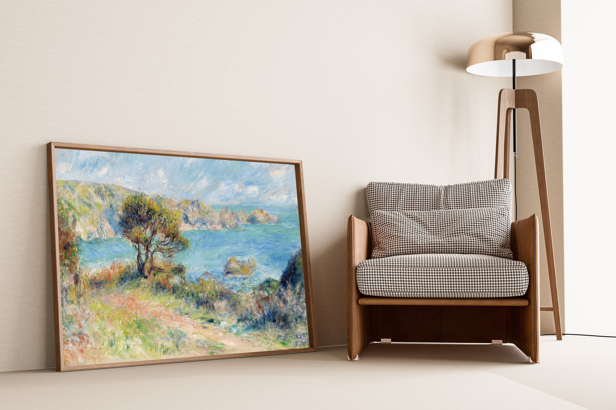 View at Guernsey by Pierre-Auguste Renoir — framed above a slim black console table
