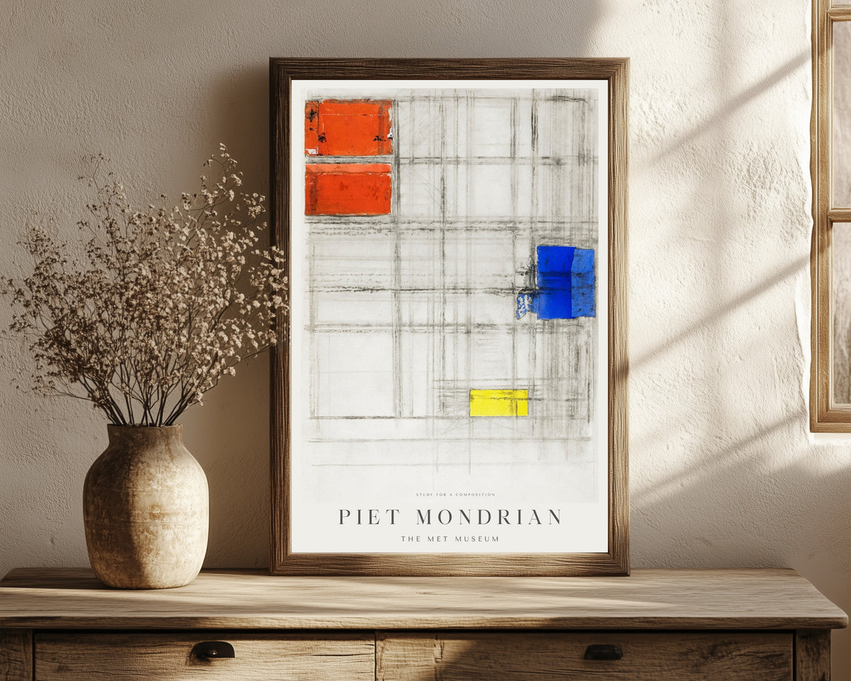 Framed art print of Study for a Composition by Piet Mondrian, in a dark wood frame leaning on a rustic console beside dried flowers