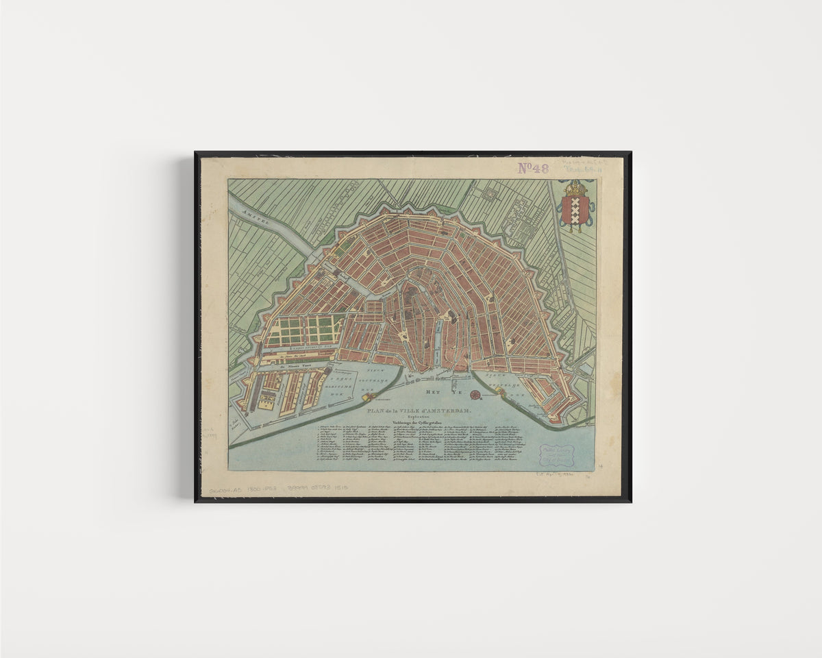 Framed art print of Plan de la Ville d'Amsterdam, in a slim black frame on a plain white wall