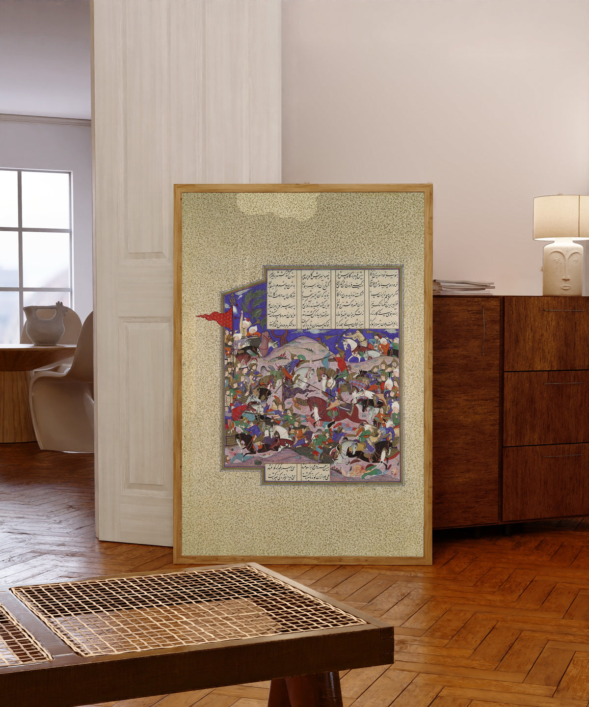 Framed art print of Shahnama of Shah Tahmasp: Bahram Recovers the… by Qadimi (attributed), in a light wood frame leaning in a warm room with a parquet floor