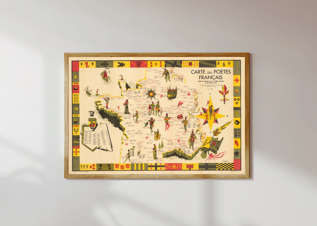 Framed art print of Carte des Poètes Français by R. Gattaz, in a light wood frame on a sunlit white wall
