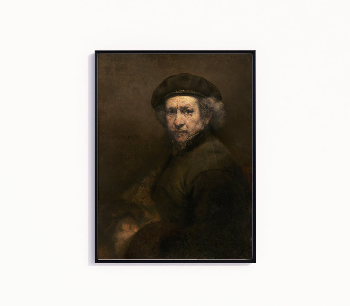 Framed art print of Self-Portrait (1659) by Rembrandt van Rijn, in a slim black frame on a plain white wall