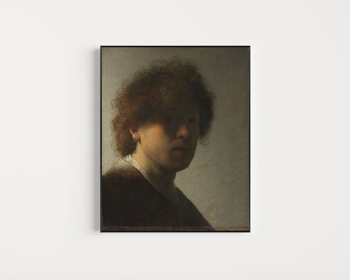 Framed art print of Self-portrait by Rembrandt van Rijn, in a slim black frame on a plain white wall