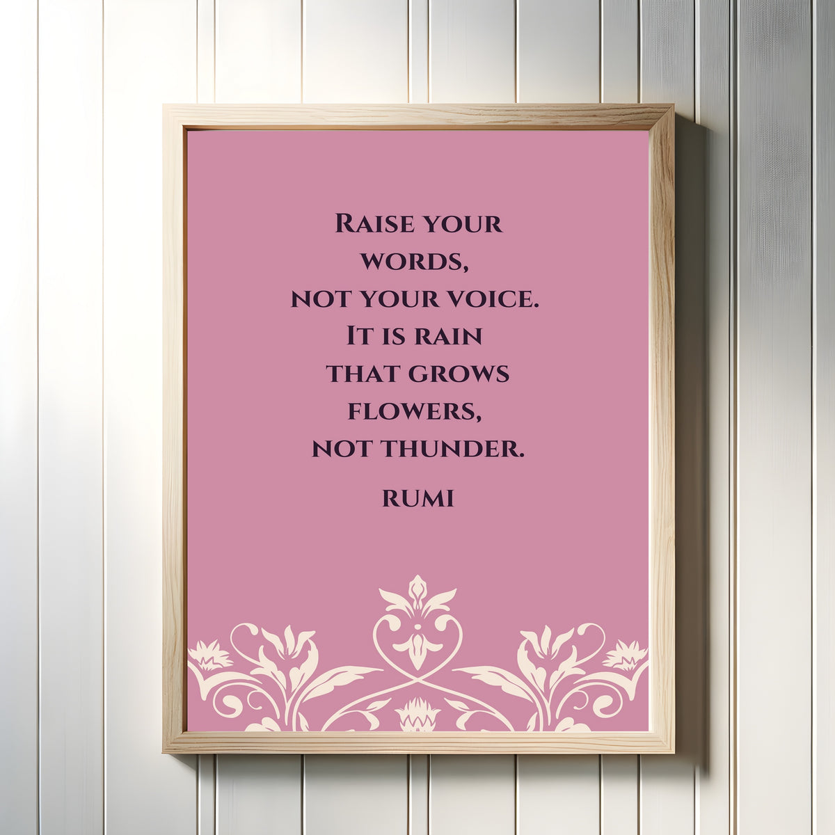 Framed art print of Rain and Thunder by Rumi, in a light wood frame on a white panelled wall