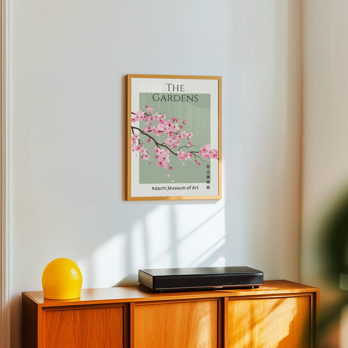 Framed art print of Sakura Cherry Blossom Museum Art Print: Emerald Green by Original, in a light wood frame on a white wall above an orange sideboard