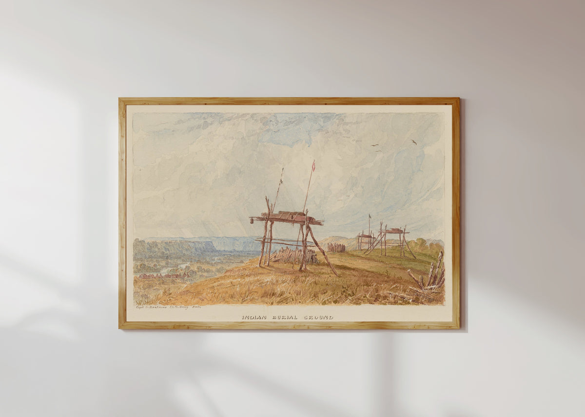 Framed art print of Indian Burial Ground by Seth Eastman, in a light wood frame on a sunlit white wall