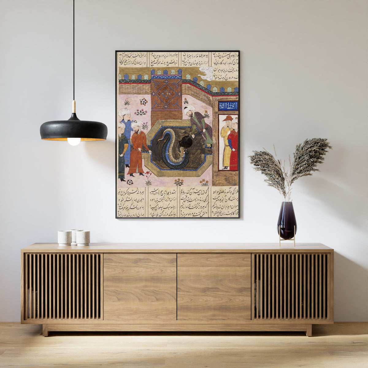 Framed art print of Shahnama: Ardashir Feeds Molten Metal to Haftvad the Worm, above a slatted wood sideboard