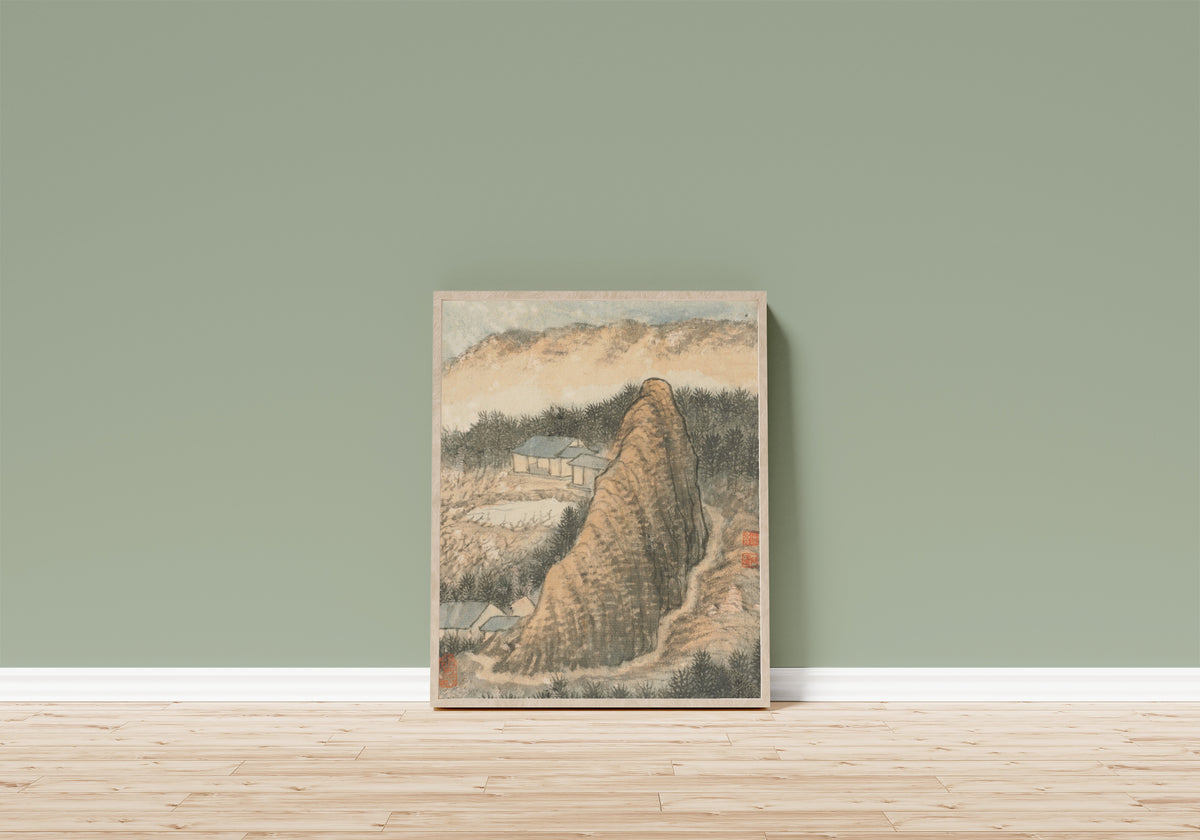Framed art print of Reminiscences of Qinhuai River (Tall Ochre Peak) by Shitao, in a light wood frame leaning on a sage green wall above a wooden floor