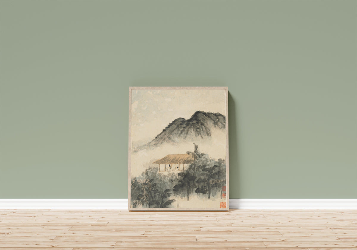 Framed art print of Reminiscences of Qinhuai River (Two Figures in a… by Shitao, in a light wood frame leaning on a sage green wall above a wooden floor