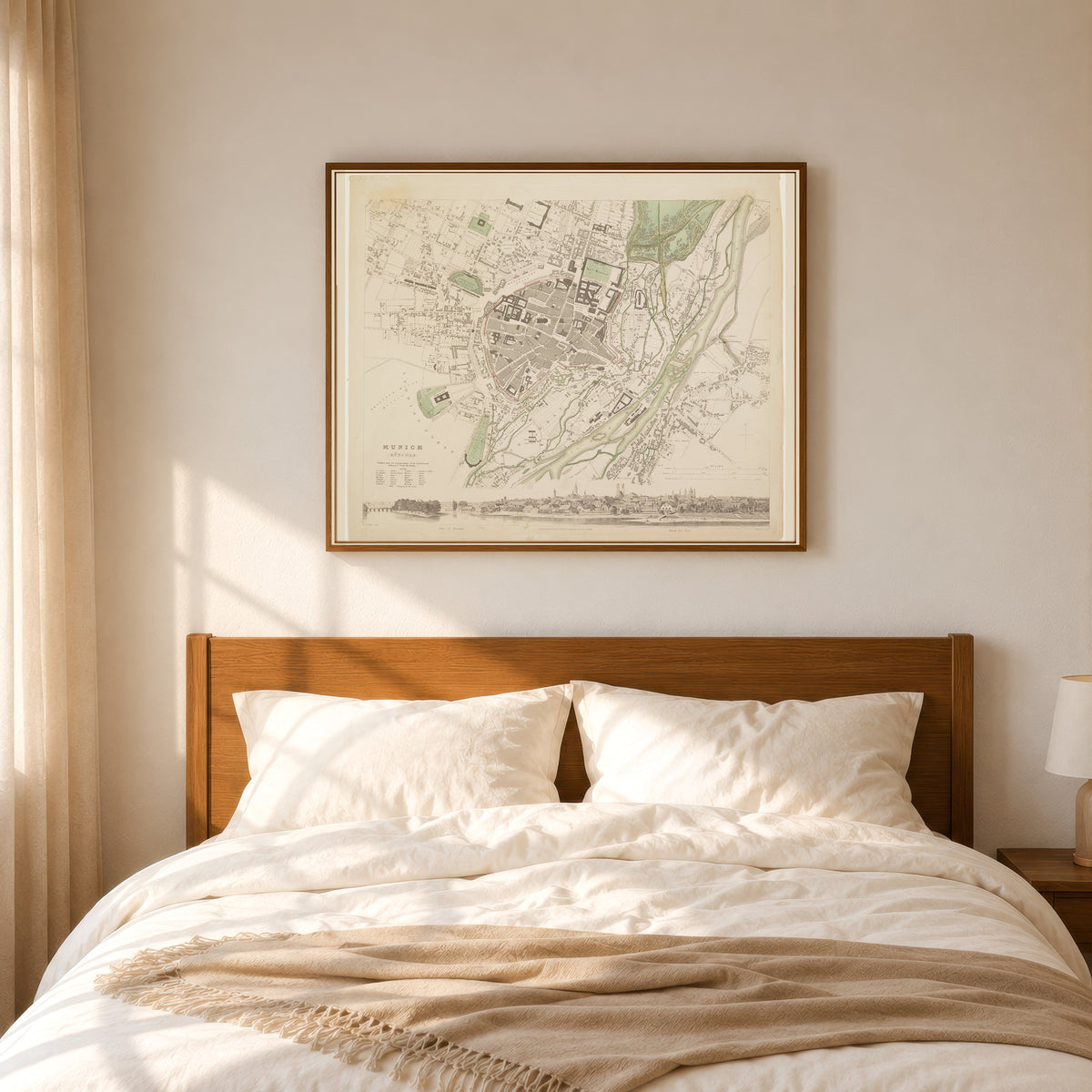 Framed art print of Munich by Society for the Diffusion of Useful Knowledge, in a slim wood frame above a bed in a sunlit bedroom