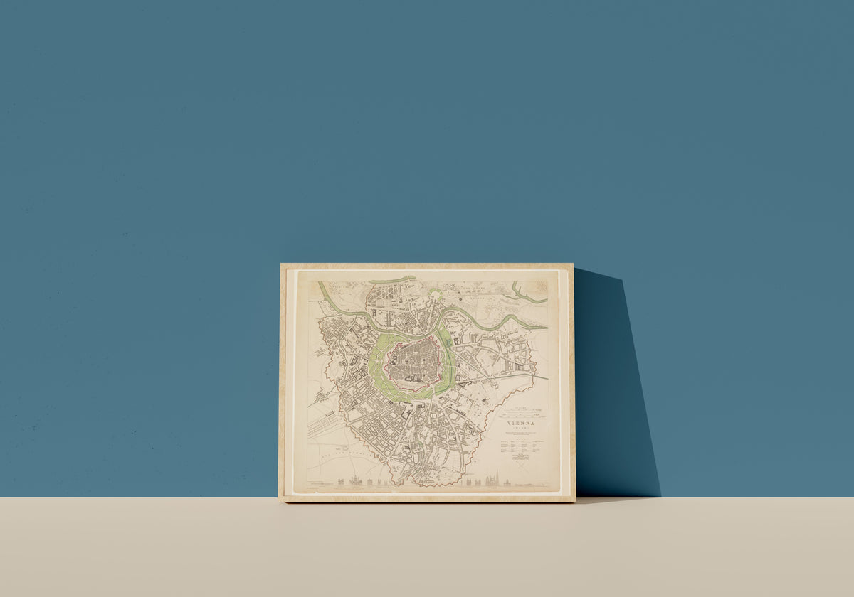 Framed art print of Vienna by Society for the Diffusion of Useful Knowledge, in a light wood frame leaning on a blue wall