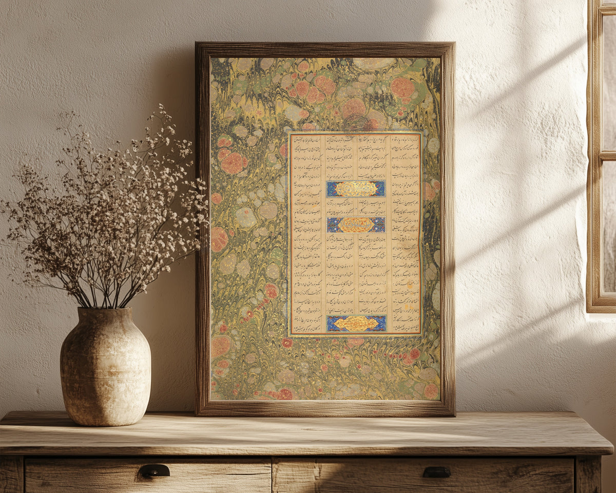 Framed art print of Page of Calligraphy from a Mantiq… by Sultan 'Ali al-Mashhadi, in a dark wood frame leaning on a rustic console beside dried flowers