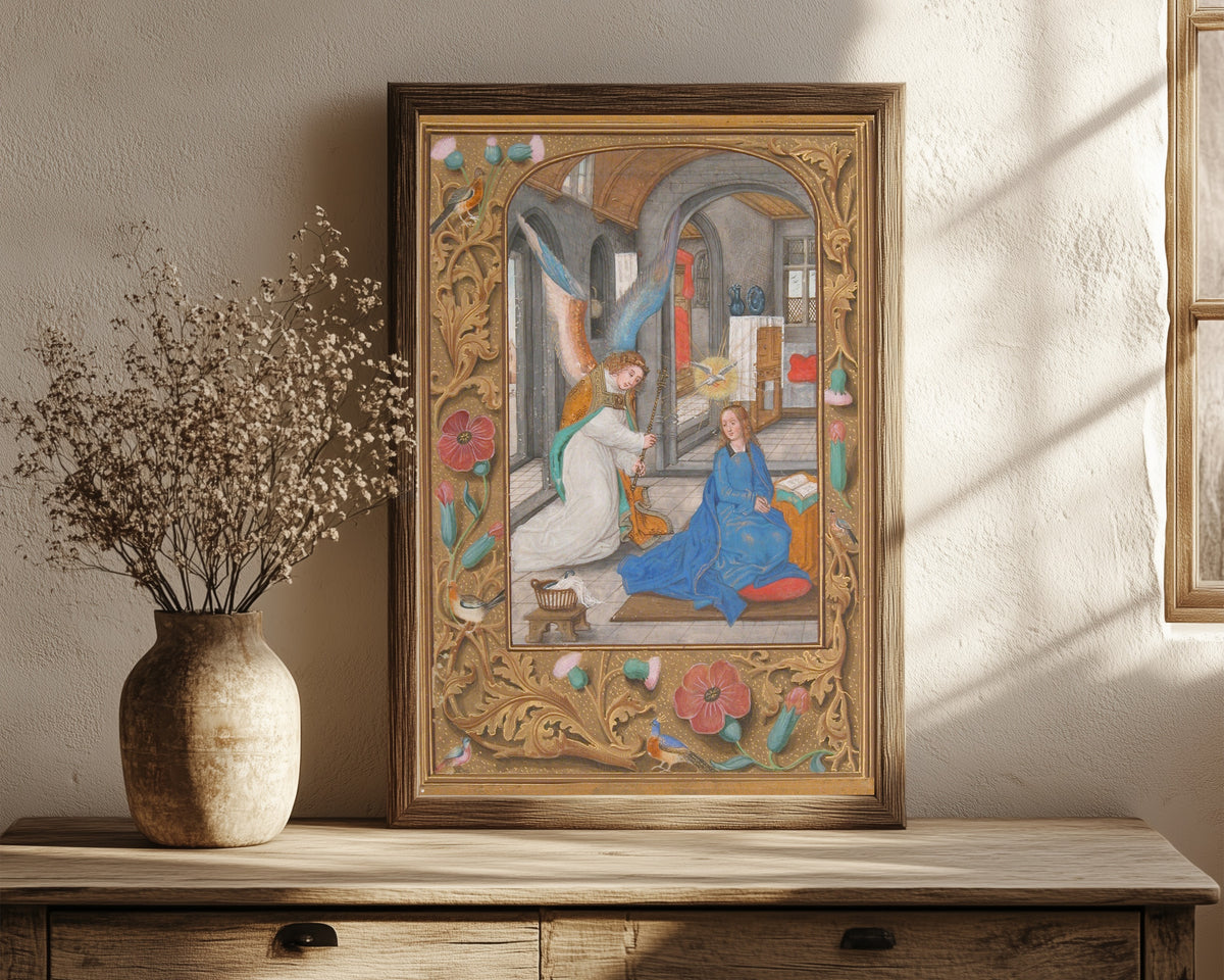 Framed art print of The Annunciation (Grey Stone Room), in a dark wood frame leaning on a rustic console beside dried flowers