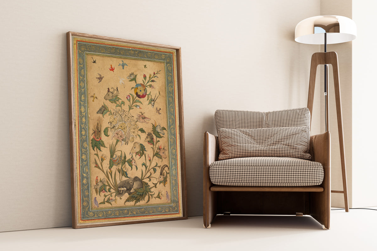 A Floral Fantasy of Animals and Birds (Waq-Waq) by Mughal Court Painting — framed and leaning against a wall beside an armchair and a floor lamp