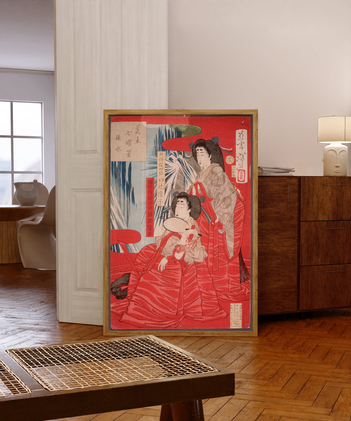 Framed art print of Cascading Water by Tsukioka Yoshitoshi, in a light wood frame leaning in a warm room with a parquet floor