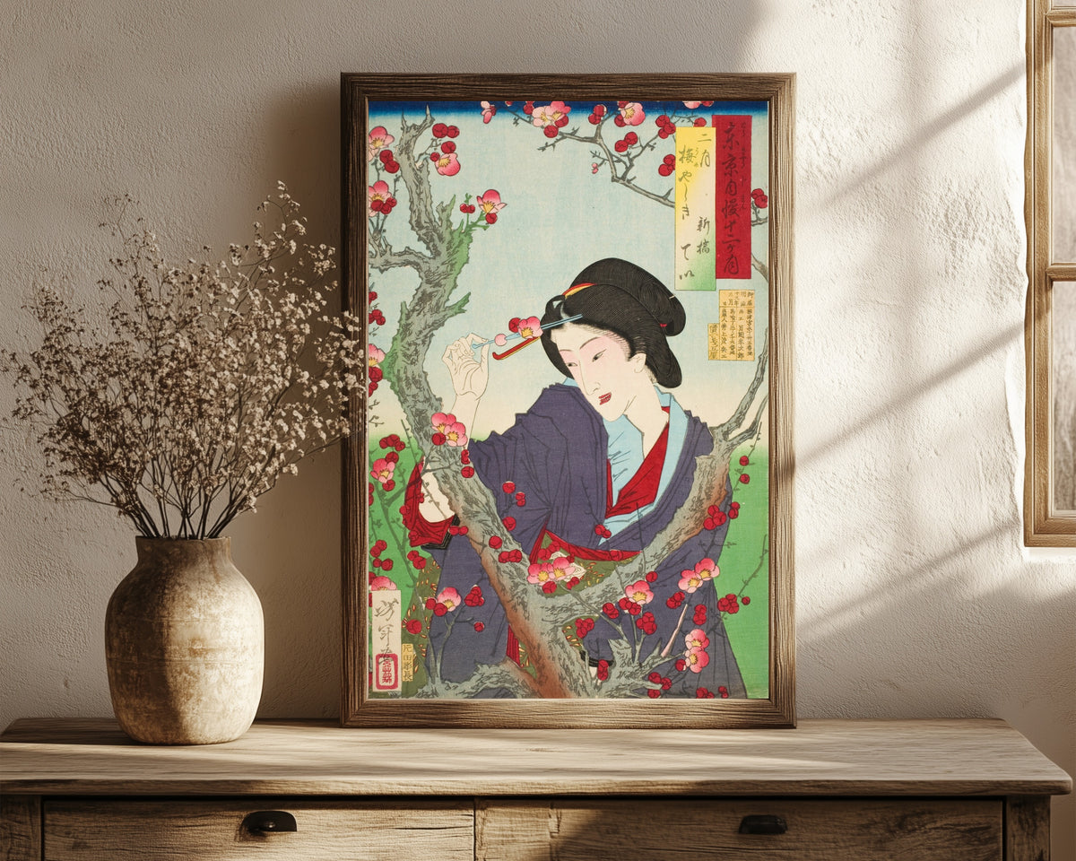 Framed art print of Second Month; Tei of Shinbashi by a Plum… by Tsukioka Yoshitoshi, in a dark wood frame leaning on a rustic console beside dried flowers