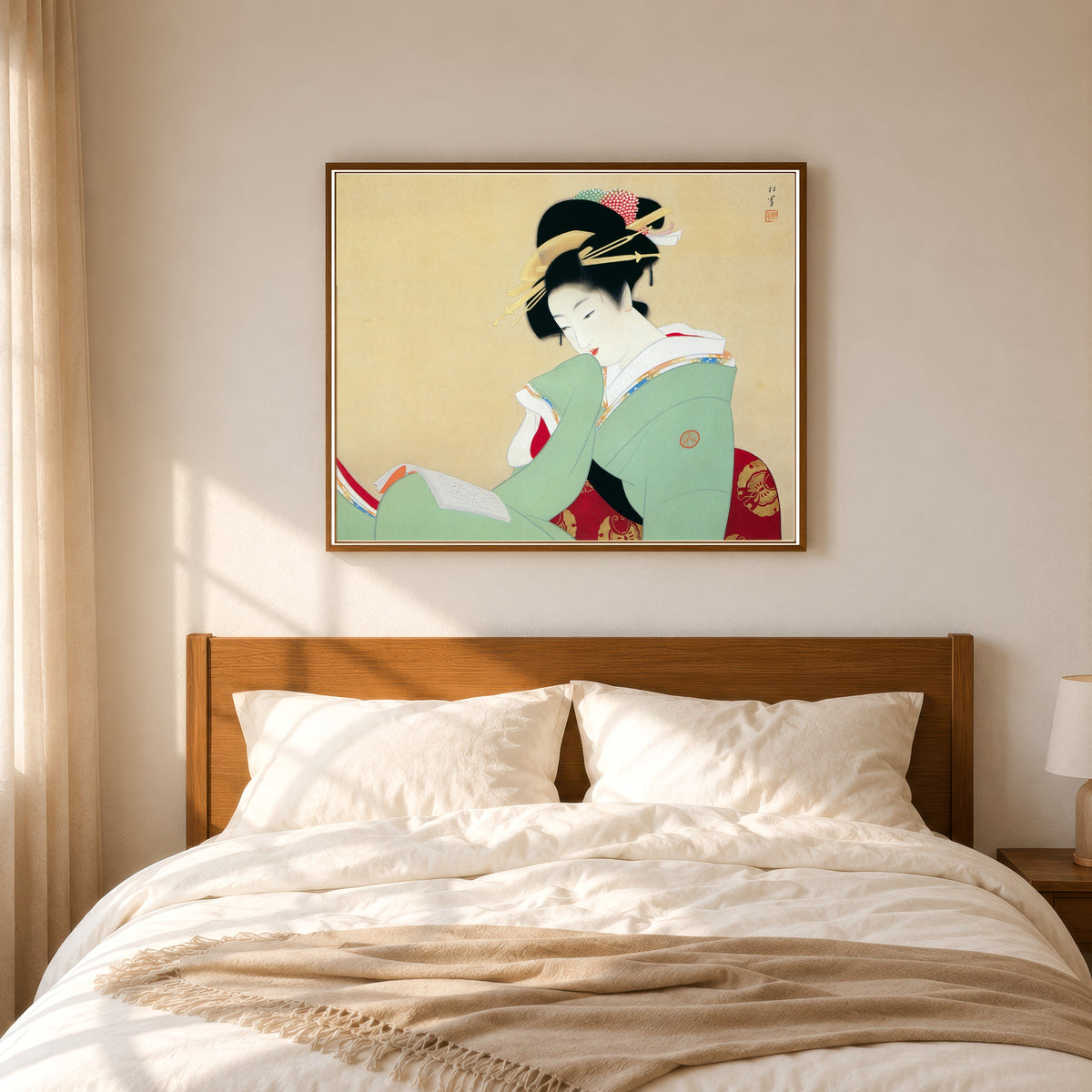Framed art print of Beautiful Woman Reading a Book by Uemura Shōen, in a slim wood frame above a bed in a sunlit bedroom