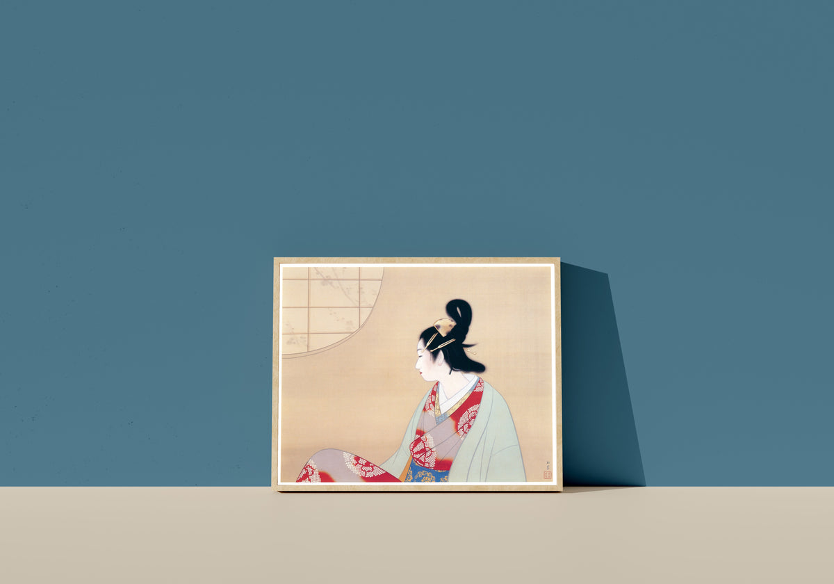 Framed art print of Young Lady by a Round Window by Uemura Shōen, in a light wood frame leaning on a blue wall