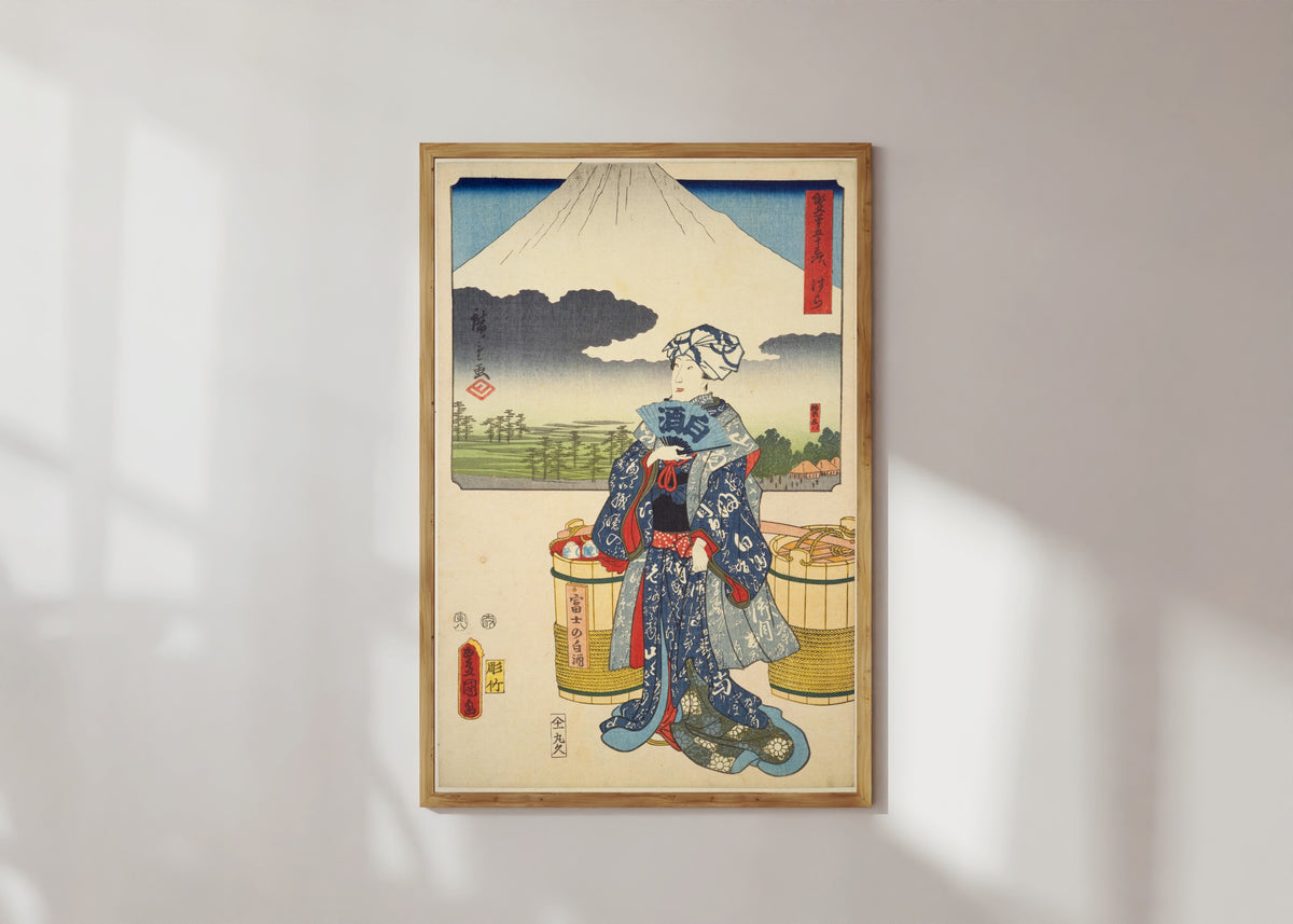 Framed art print of Fifty-three Stations by Two Brushes: Hara by Utagawa Hiroshige & Utagawa Kunisada, in a light wood frame on a sunlit white wall