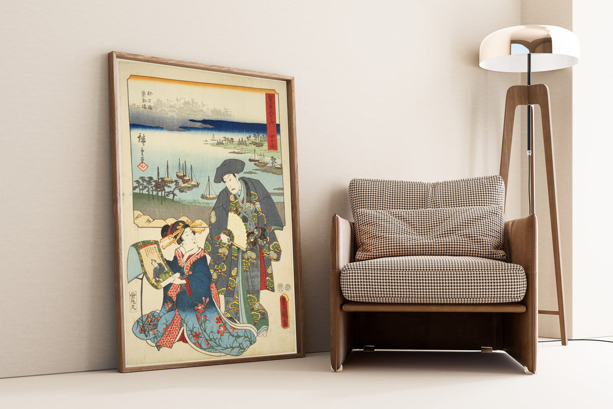 Fifty-three Stations by Two Brushes: Yokkaichi by Utagawa Hiroshige & Utagawa Kunisada — framed and leaning against a wall beside an armchair and a floor lamp