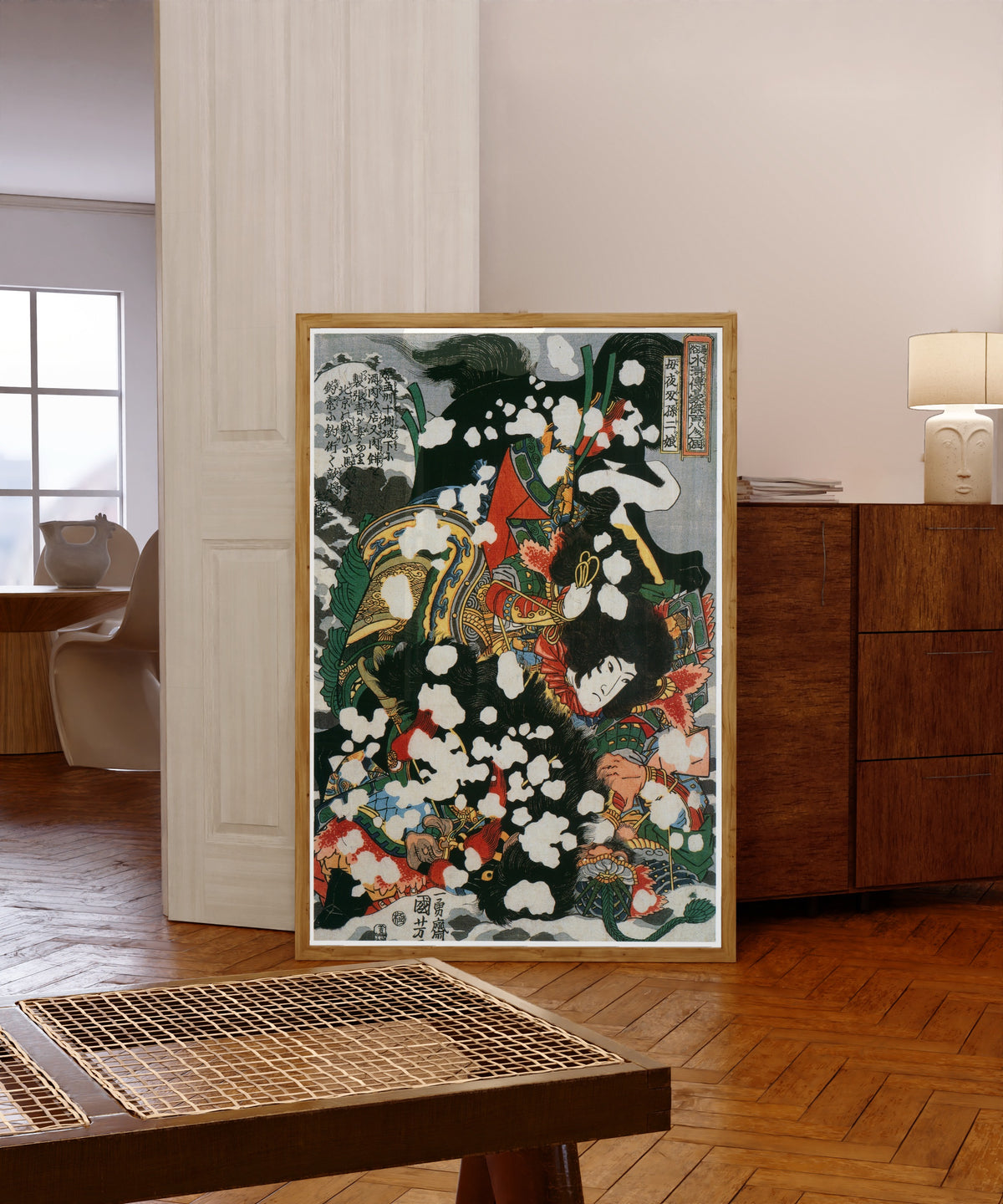 Framed art print of 108 Heroes of the Suikoden: Boyasha Sonnijō by Utagawa Kuniyoshi, in a light wood frame leaning in a warm room with a parquet floor