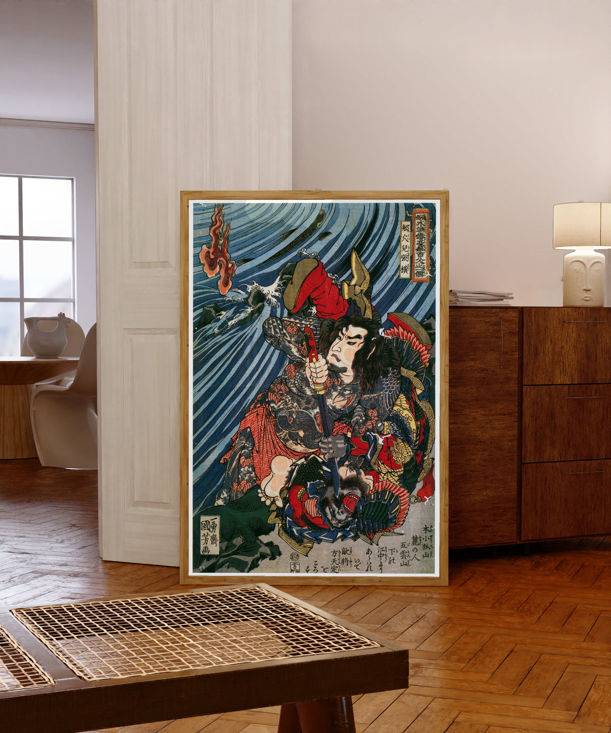 Framed art print of 108 Heroes of the Suikoden: Senkaji Chōō by Utagawa Kuniyoshi, in a light wood frame leaning in a warm room with a parquet floor