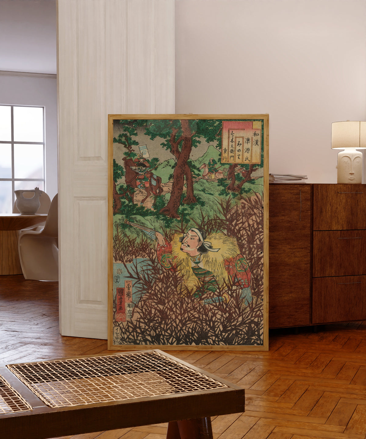 Framed art print of Suzuki Saemon Shigeyuki by Utagawa Kuniyoshi, in a light wood frame leaning in a warm room with a parquet floor