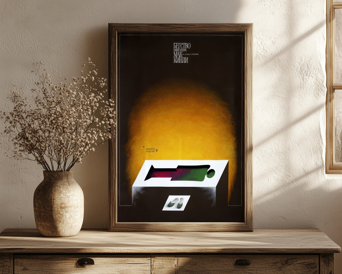 Framed art print of The Escape of Mr. McKinley by V. Strimaitis, in a dark wood frame leaning on a rustic console beside dried flowers