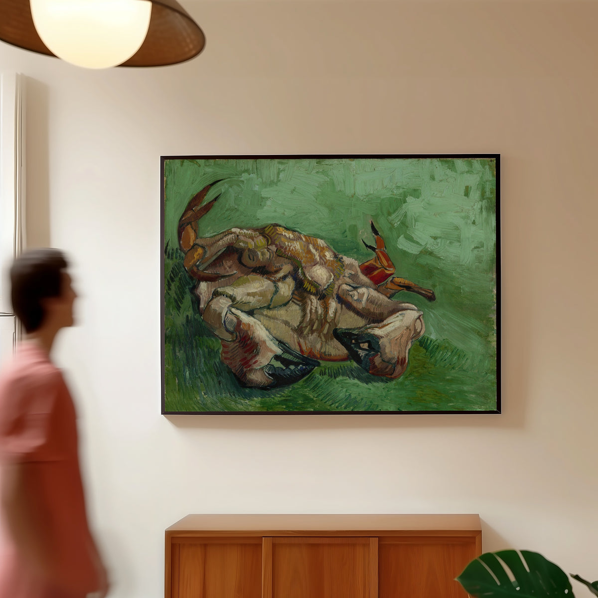 Framed art print of A Crab on its Back by Vincent van Gogh, in a slim black frame on a warm wall in a sunlit room