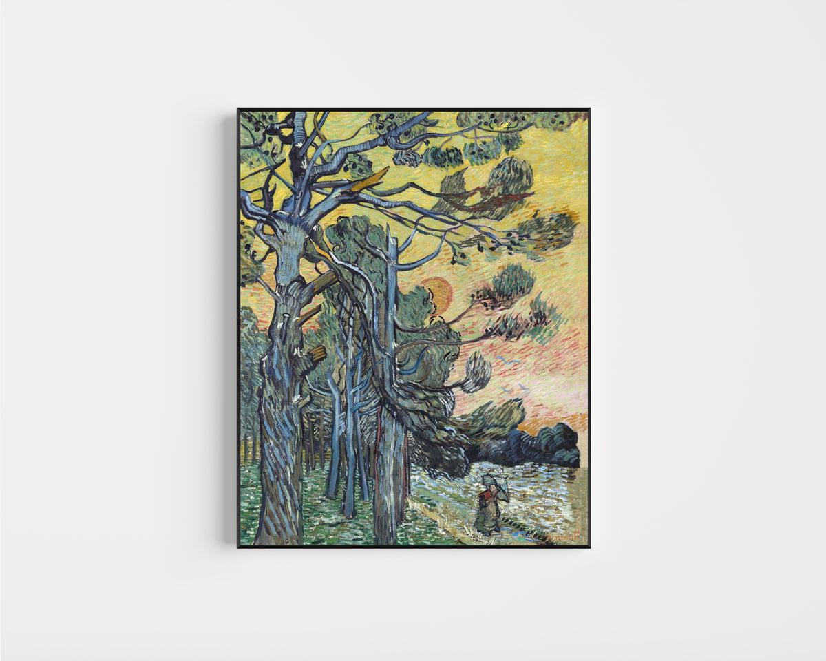 Framed art print of Pine Trees at Sunset by Vincent van Gogh, in a slim black frame on a plain white wall