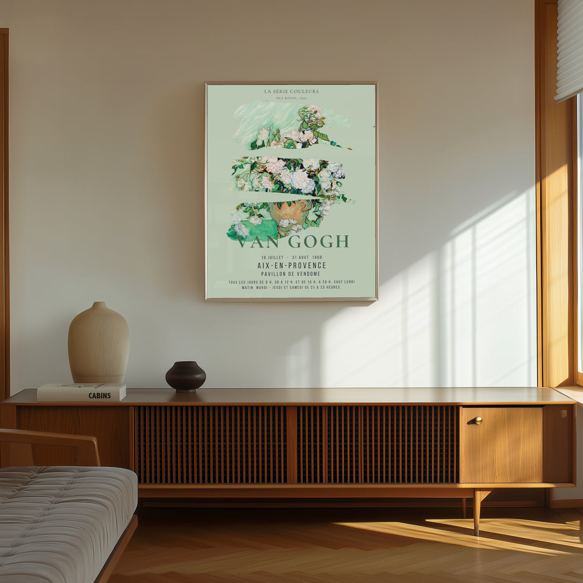 Framed art print of Roses by Vincent van Gogh, in a thin light frame on a sunlit wall above a wooden sideboard