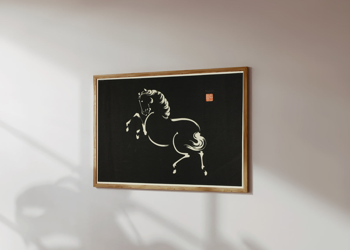 Framed art print of Rearing Horse by Wakyosai, in a light wood frame on a sunlit white wall, seen at a slight angle