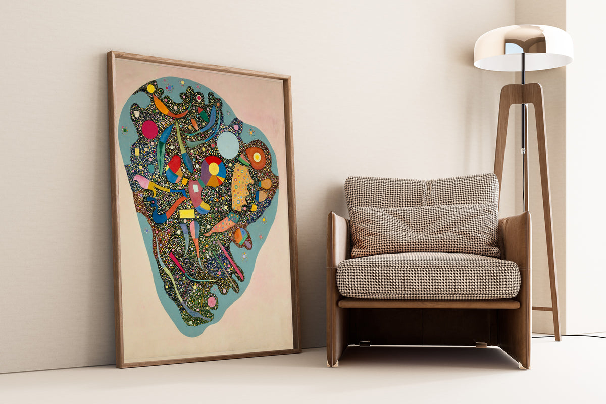 Regulated Heap by Wassily Kandinsky — framed and leaning against a wall beside an armchair and a floor lamp