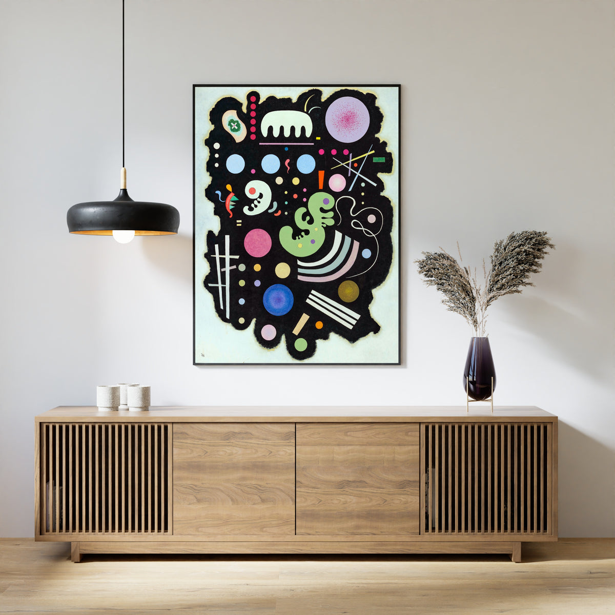 Variegated Black by Wassily Kandinsky — framed above a slatted wood sideboard