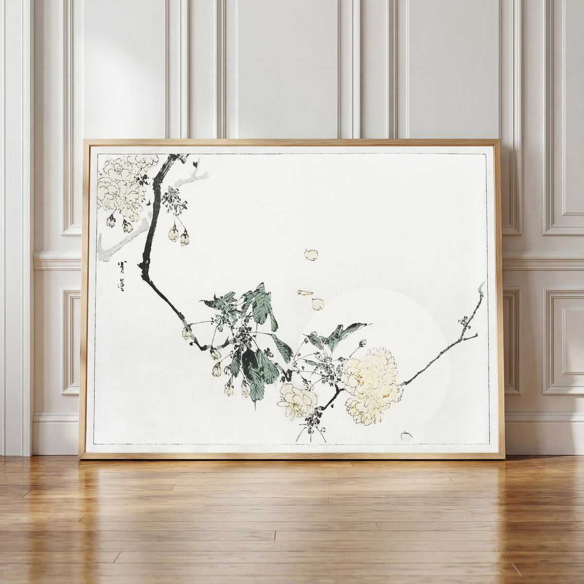 Framed art print of Cherry Blossom by Watanabe Seitei, in a light wood frame leaning against a panelled white wall