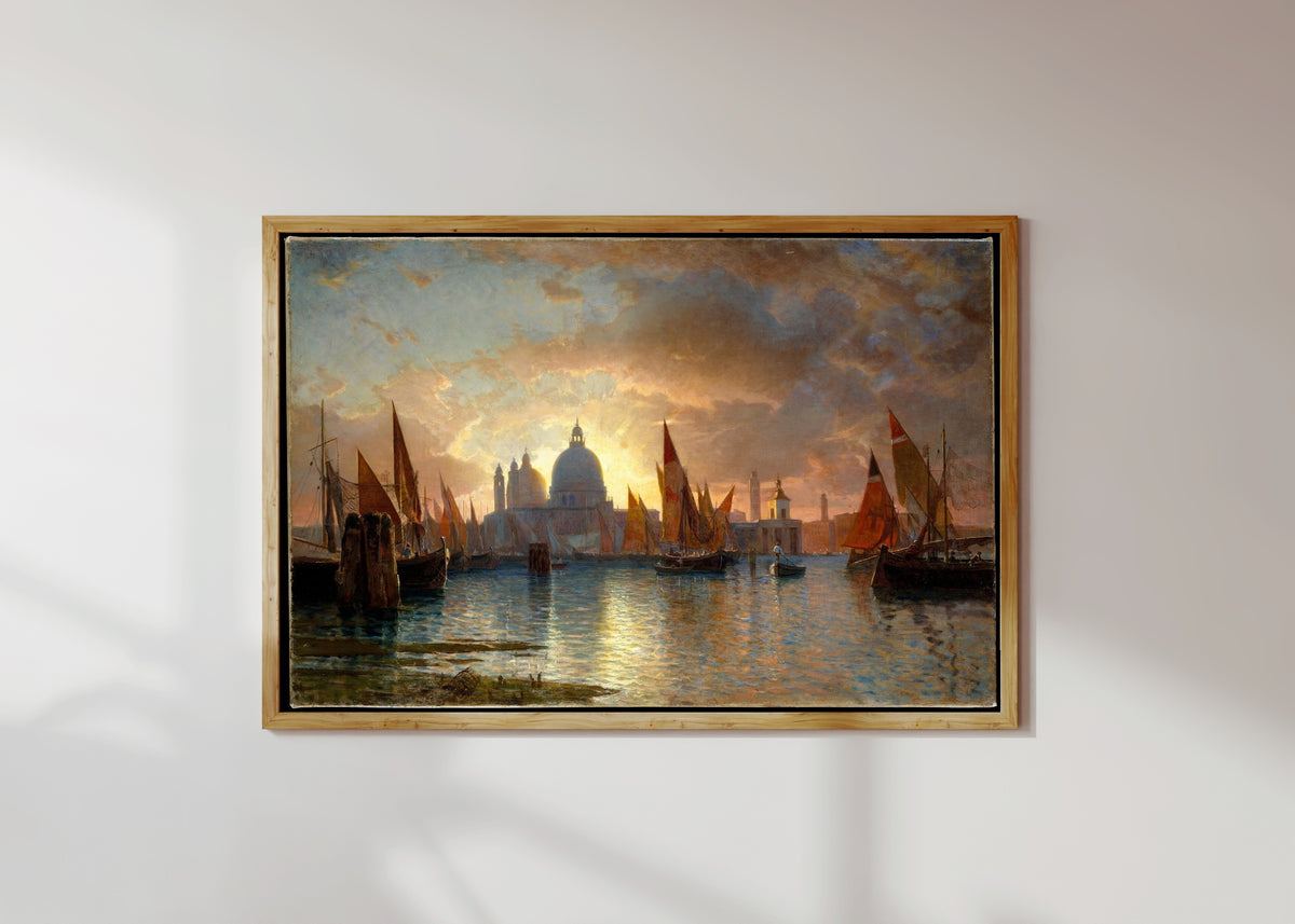 Framed art print of Santa Maria della Salute Sunset Seascape by William Stanley Haseltine, in a light wood frame on a sunlit white wall