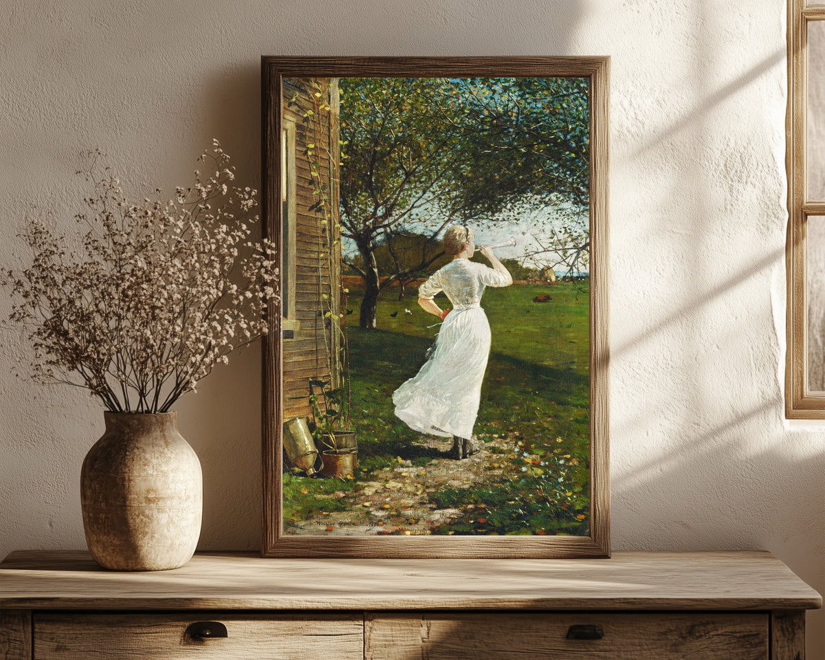 Framed art print of The Dinner Horn by Winslow Homer, in a dark wood frame leaning on a rustic console beside dried flowers