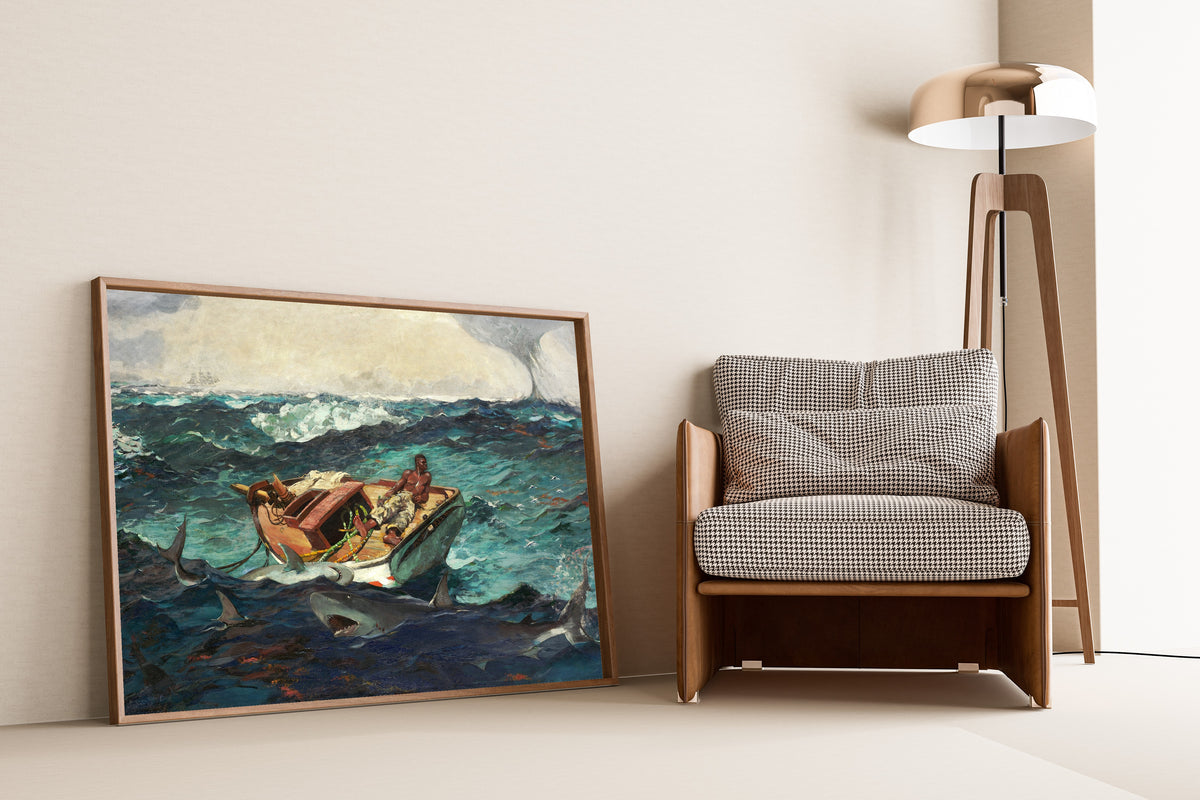 The Gulf Stream by Winslow Homer — framed and leaning against a wall beside an armchair and a floor lamp