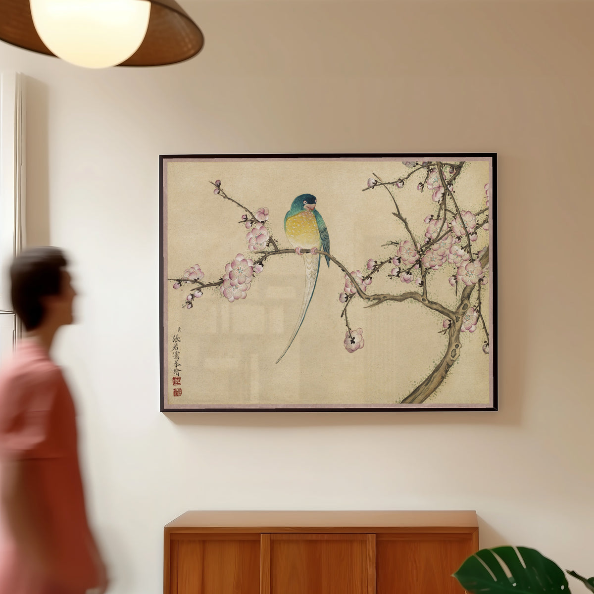 Framed art print of Desk Album: Flower and Bird Paintings (Bird with Plum Blossoms) by Zhang Ruoai, in a slim black frame on a warm wall in a sunlit room
