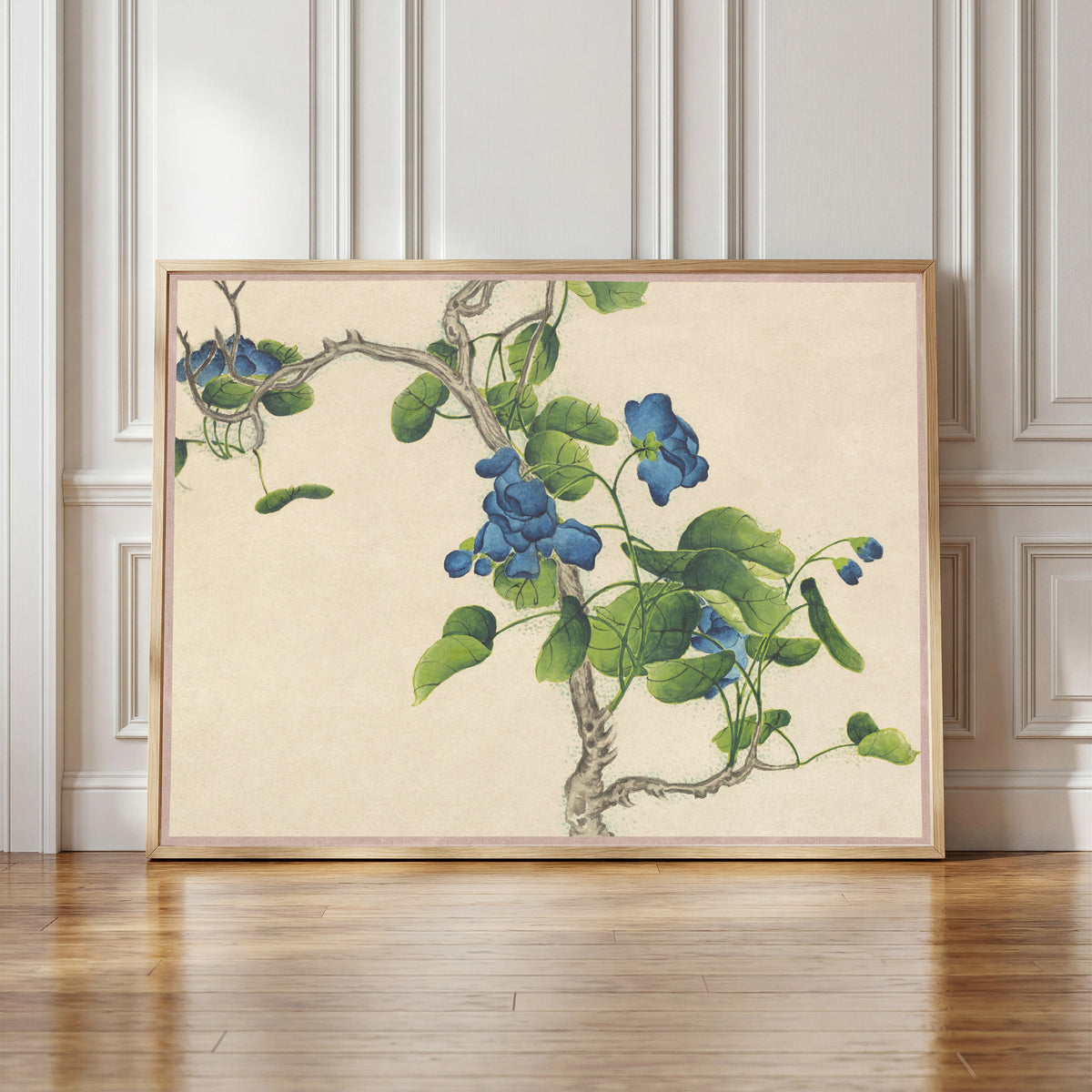 Framed art print of Desk Album: Flower and Bird Paintings (Climbing Blue Flowers) by Zhang Ruoai, in a light wood frame leaning against a panelled white wall