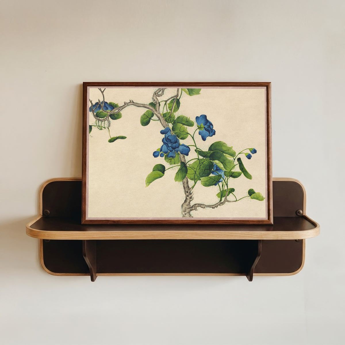 Framed art print of Desk Album: Flower and Bird Paintings (Climbing Blue Flowers) by Zhang Ruoai, in a dark wood frame resting on a wall shelf