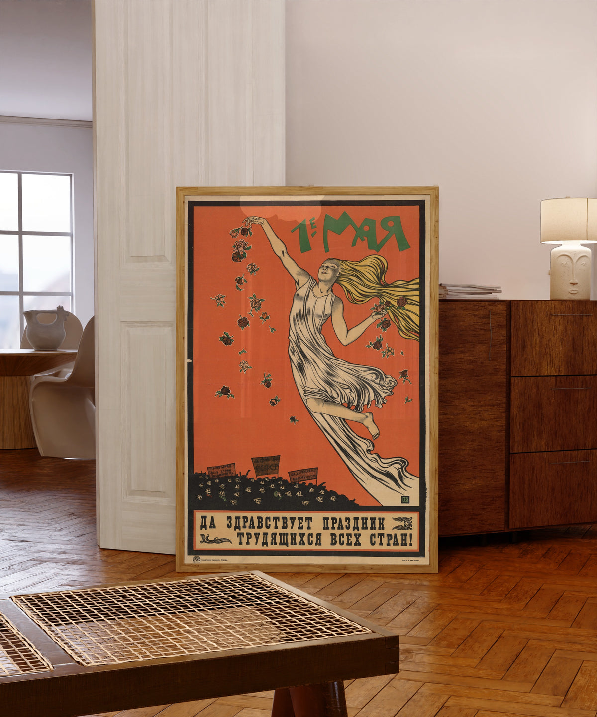 Framed art print of 1st of May. Long live the holiday of the working… by Sergey Ivanov, in a light wood frame leaning in a warm room with a parquet floor