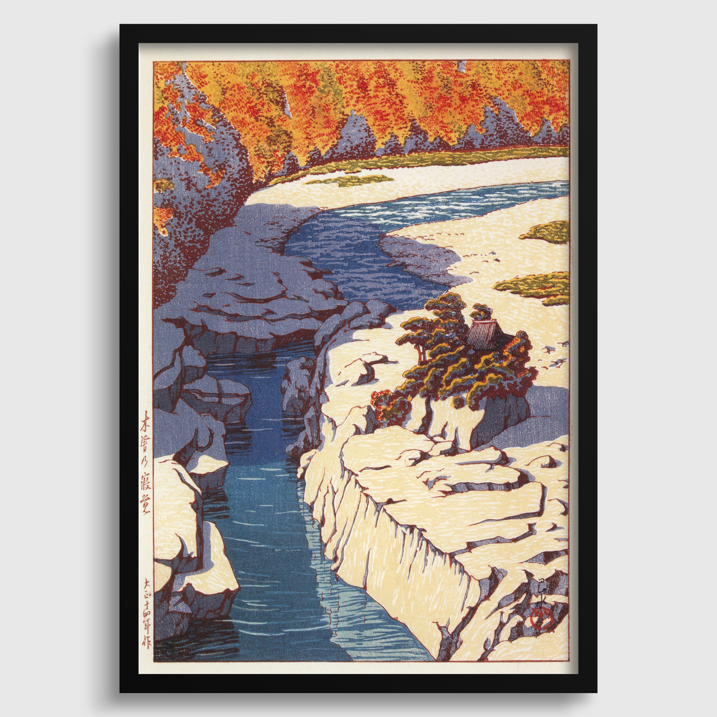 The image is a framed print depicting a scenic landscape with a river, cliffs, and trees in autumn colors.