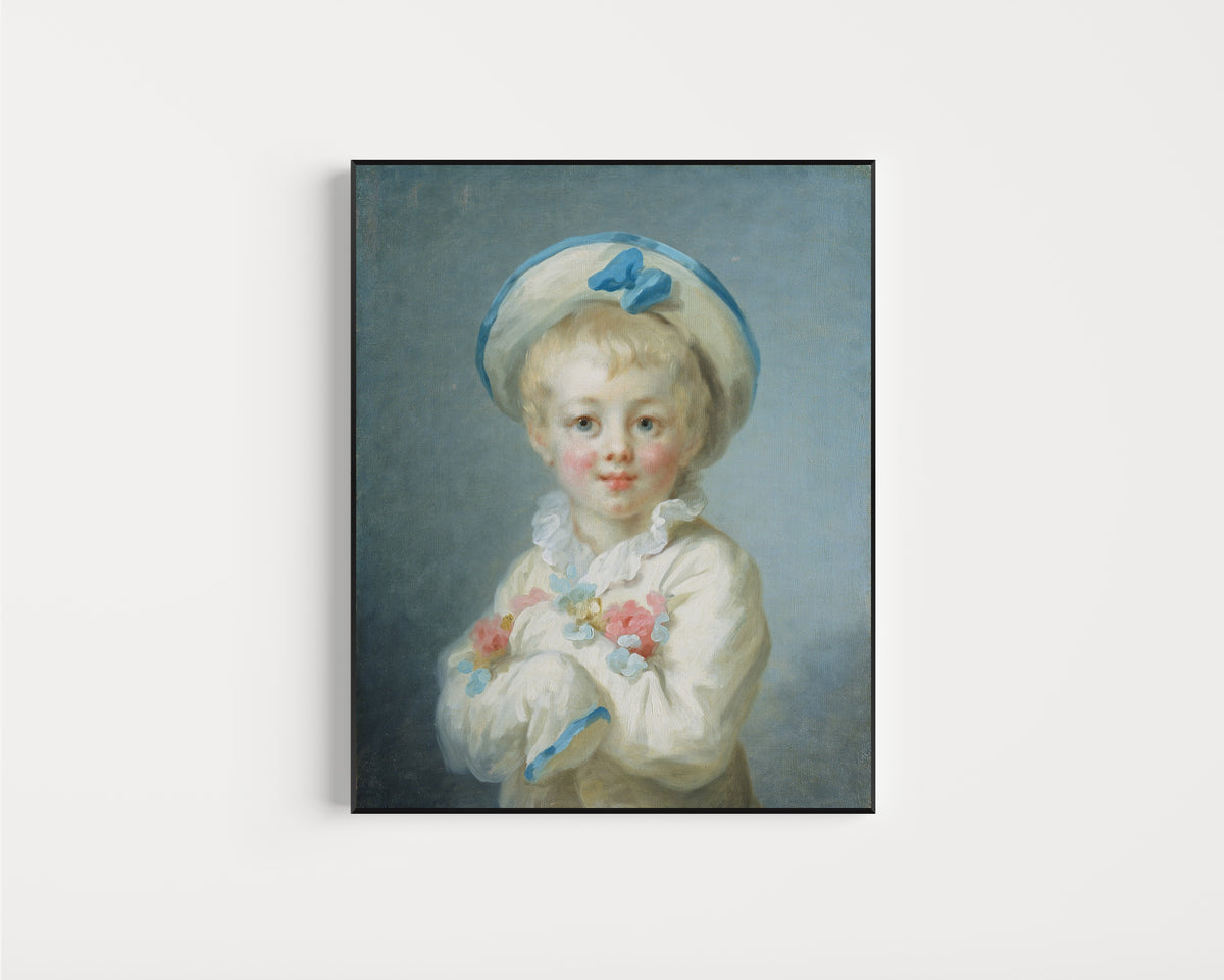 Framed art print of A Boy as Pierrot by Jean-Honoré Fragonard, in a slim black frame on a plain white wall