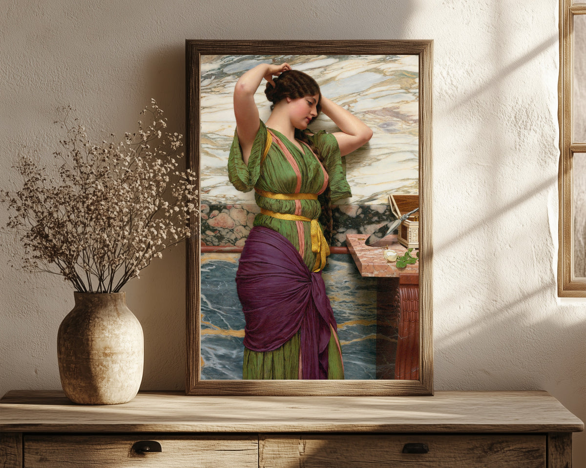Framed art print of A Fair Reflection by John William Godward, in a dark wood frame leaning on a rustic console beside dried flowers
