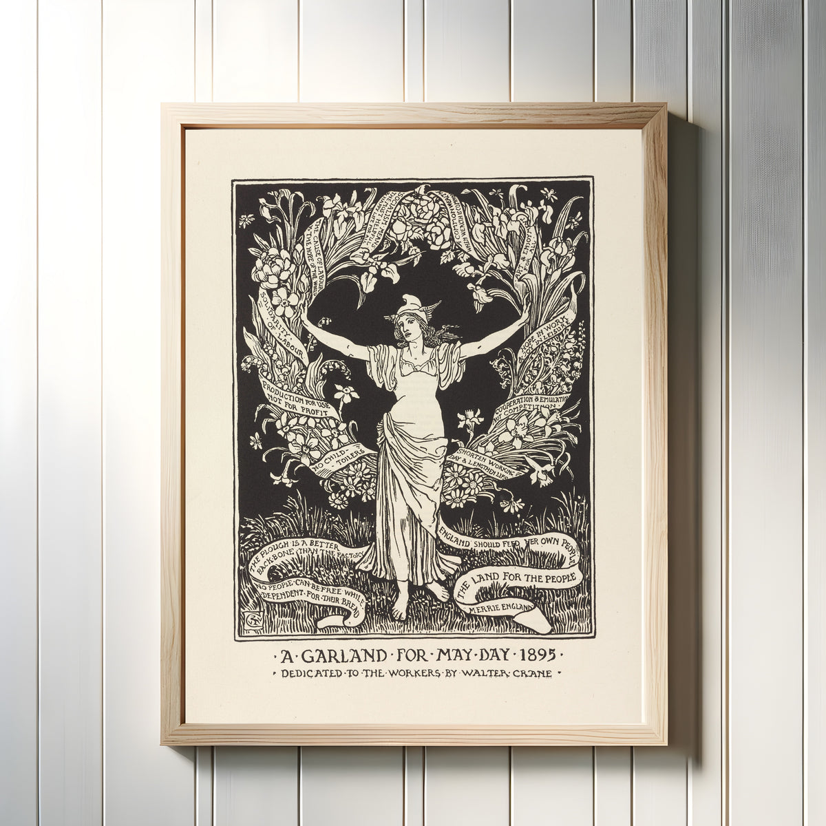 Framed art print of A Garland for May Day by Walter Crane, in a light wood frame on a white panelled wall
