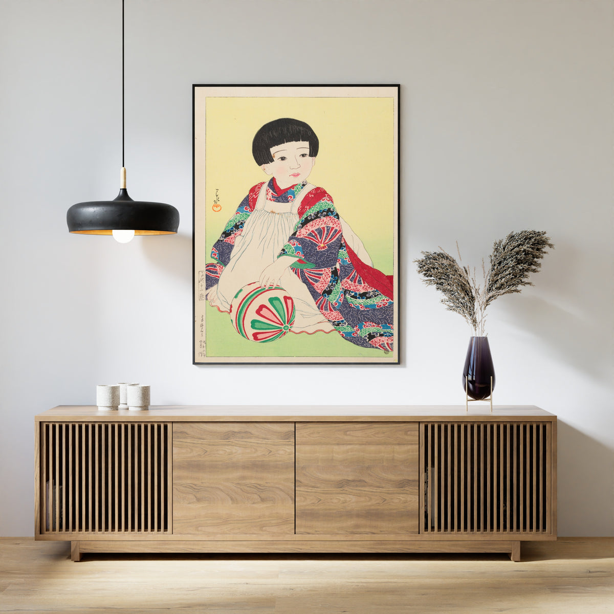 Framed art print of A Hand Ball, Portrait of Takagi Junko by Kawase Hasui, above a slatted wood sideboard
