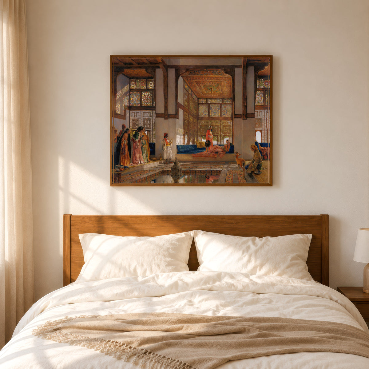 Framed art print of A Lady Receiving Visitors (The Reception) by John Frederick Lewis, in a slim wood frame above a bed in a sunlit bedroom