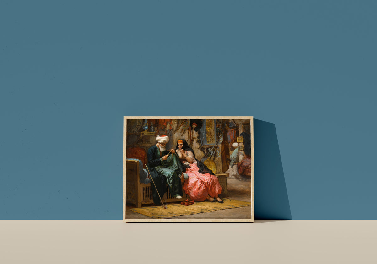 Framed art print of A Precious Jewel by Frederick Arthur Bridgman, in a light wood frame leaning on a blue wall